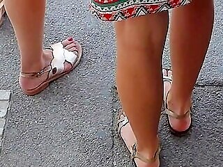 Beautiful Gams And Feet In Sandals Of Two Attractive Youthful Women